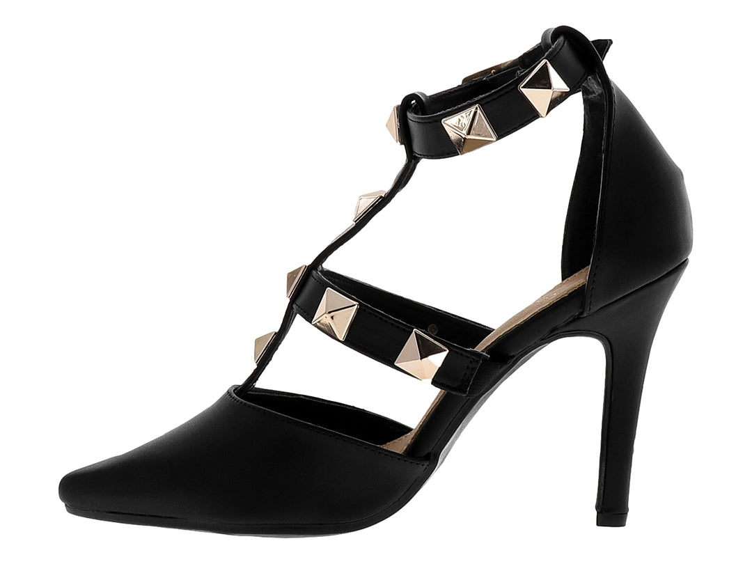 Zapato de tacón alto negro con tiras y remaches dorados, punta fina.