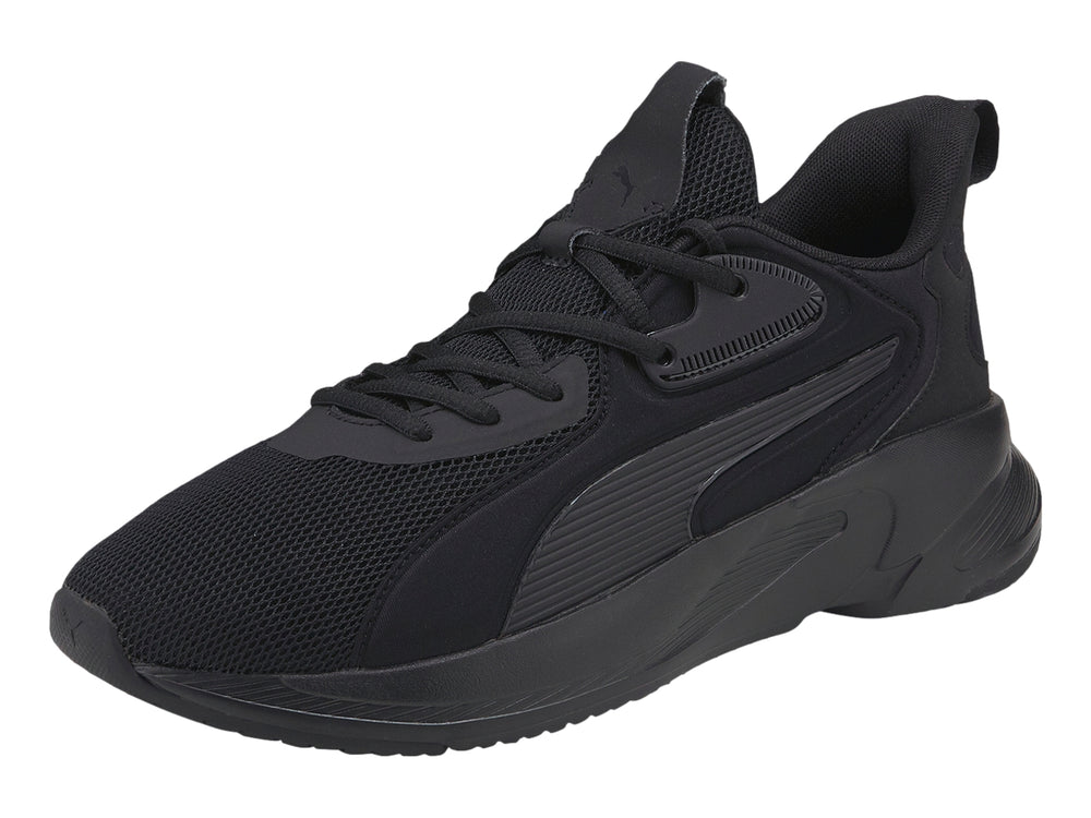 Tenis deportivos PUMA de color negro con suela gruesa y parte superior de malla.