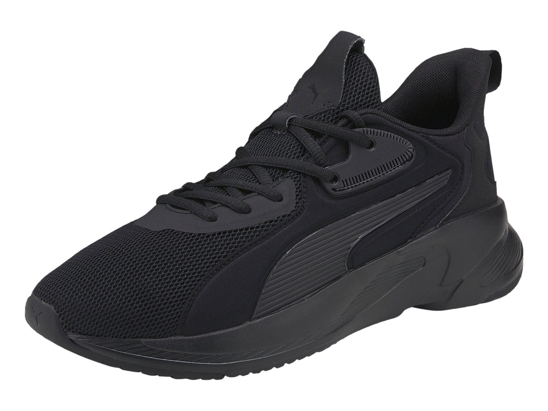 Tenis deportivos PUMA de color negro con suela gruesa y parte superior de malla.