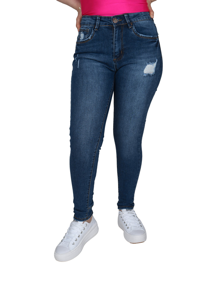 Pantalones jeans ajustados color azul con detalles de destrucción en las piernas.