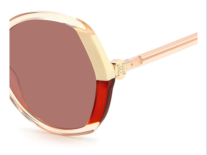 Lentes de sol Carolina Herrera para mujer en color beige con cristales marrón y detalles metálicos dorados.