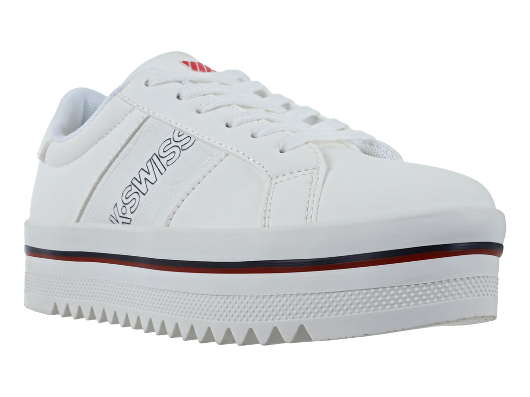 Tenis blancos K-SWISS ZULIK V con suela de plataforma gruesa y detalle en línea roja oscura.