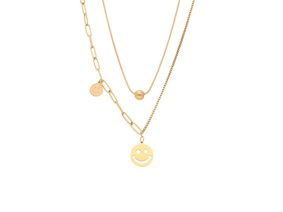 Set de collares en color oro con dijes de caritas felices y una esfera pequeña.