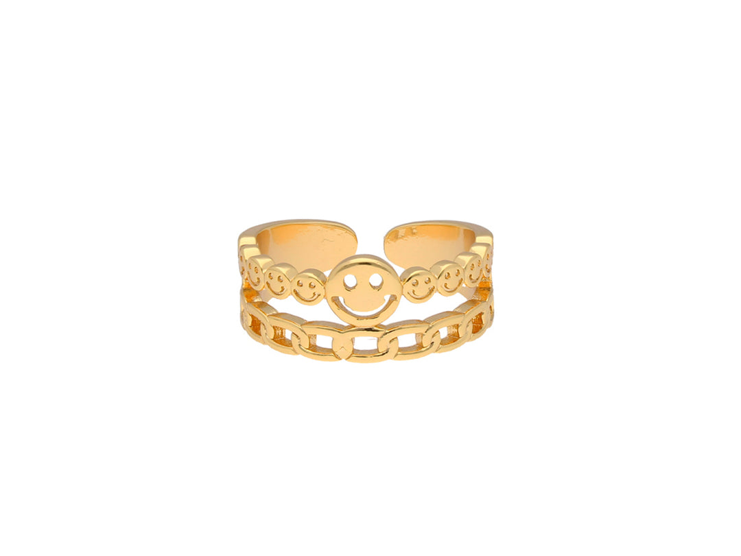 Anillo de color oro con diseño de caritas felices y eslabones de cadena.