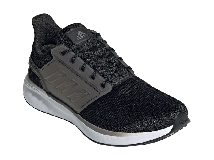 Tenis deportivos Adidas para mujer en color negro y gris con suela blanca.