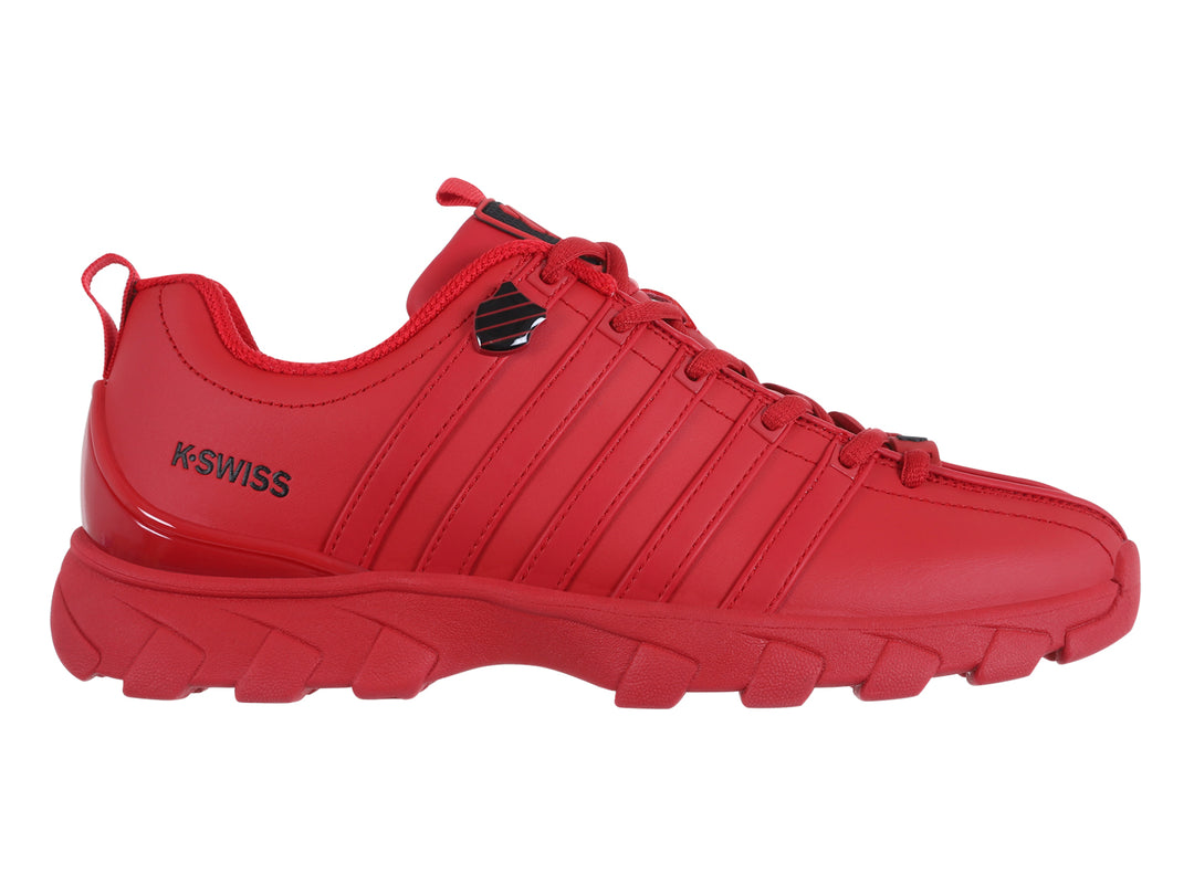 Tenis K-Swiss modelo Haxby 2.0 en color rojo intenso con suela robusta y detalles lineales en el cuerpo.
