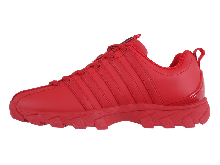 Tenis K-Swiss modelo Haxby 2.0 en color rojo intenso con suela robusta y detalles lineales en el cuerpo.