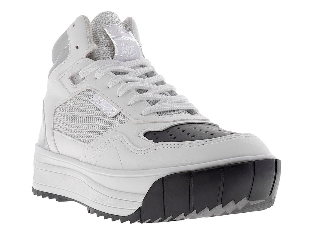 Tenis blancos de plataforma con suela negra y detalles de malla lateral.
