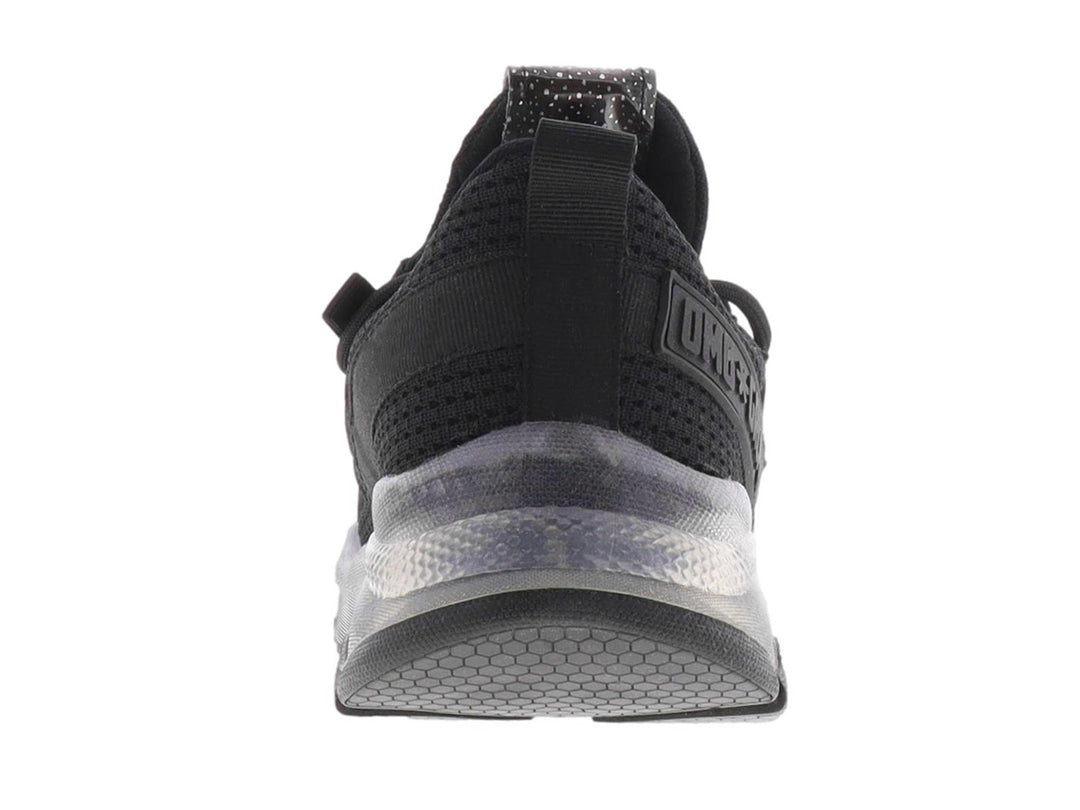 Tenis casuales color negro para mujer con tejido texturizado y suela translúcida.