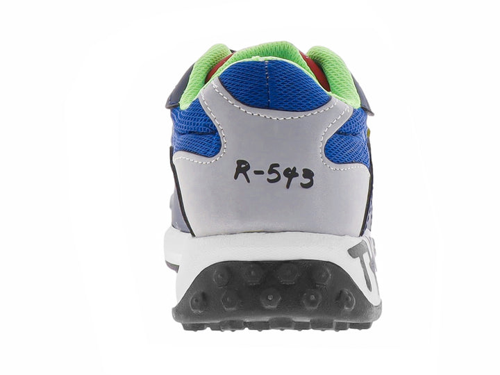 Zapato deportivo infantil color azul cobalto con detalles en blanco, negro y verde lima.
