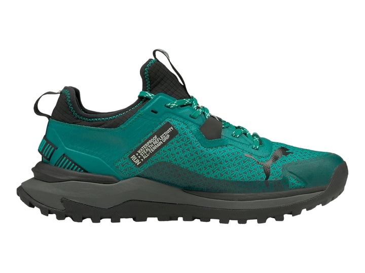 Tenis PUMA Voyage Nitro GTX color verde azulado con suela gris oscuro y detalles negros.