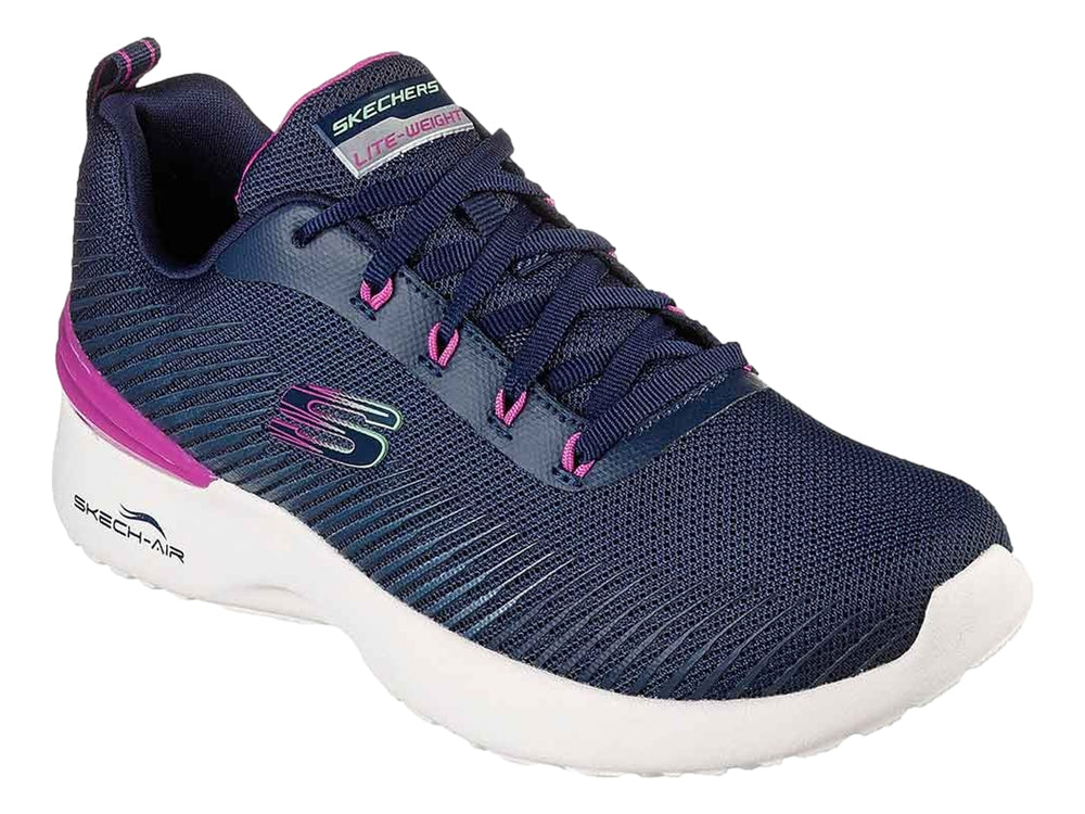 Tenis deportivos Skechers para mujer en color azul marino con detalles en rosa y suela blanca.