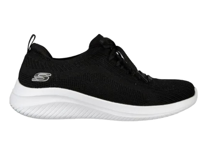 Tenis deportivos Skechers para mujer en color negro con suela blanca.