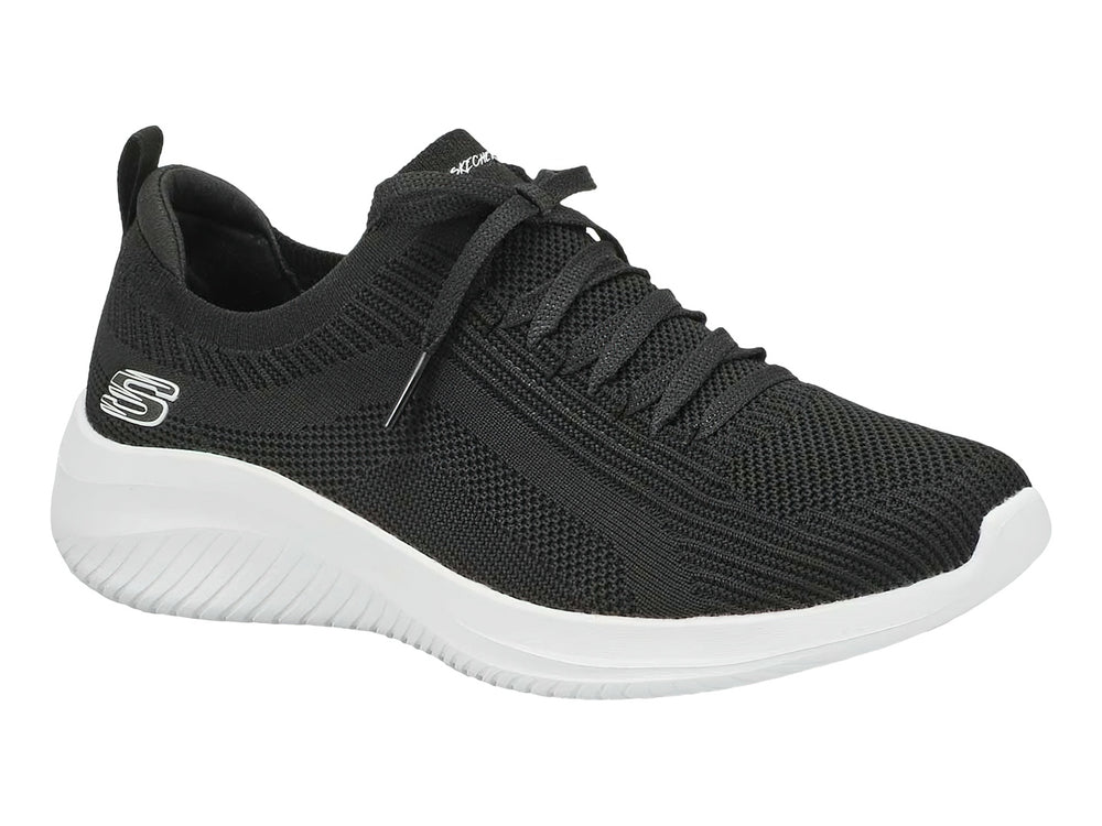Tenis deportivos Skechers para mujer en color negro con suela blanca.