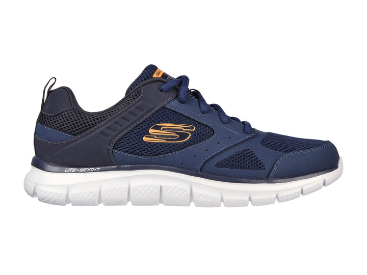 Tenis deportivos Skechers color azul marino con suela blanca y detalles naranjas.