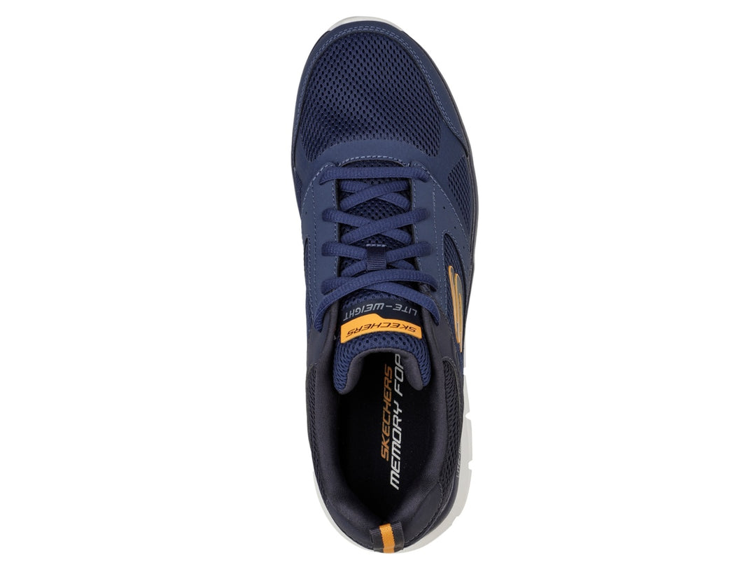 Tenis deportivos Skechers color azul marino con suela blanca y detalles naranjas.