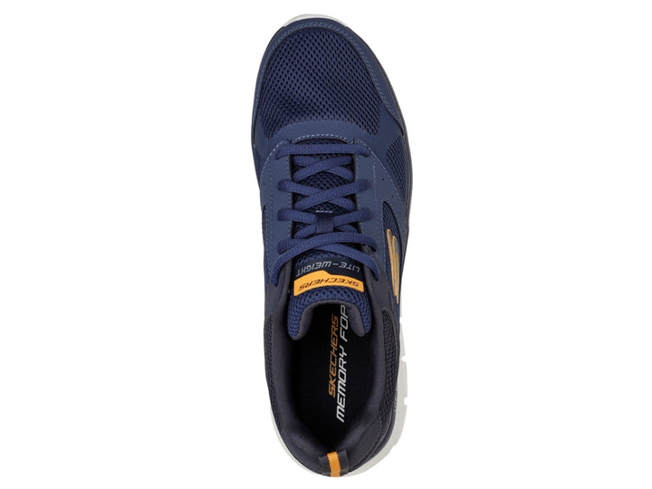 Tenis deportivos Skechers color azul marino con suela blanca y detalles naranjas.