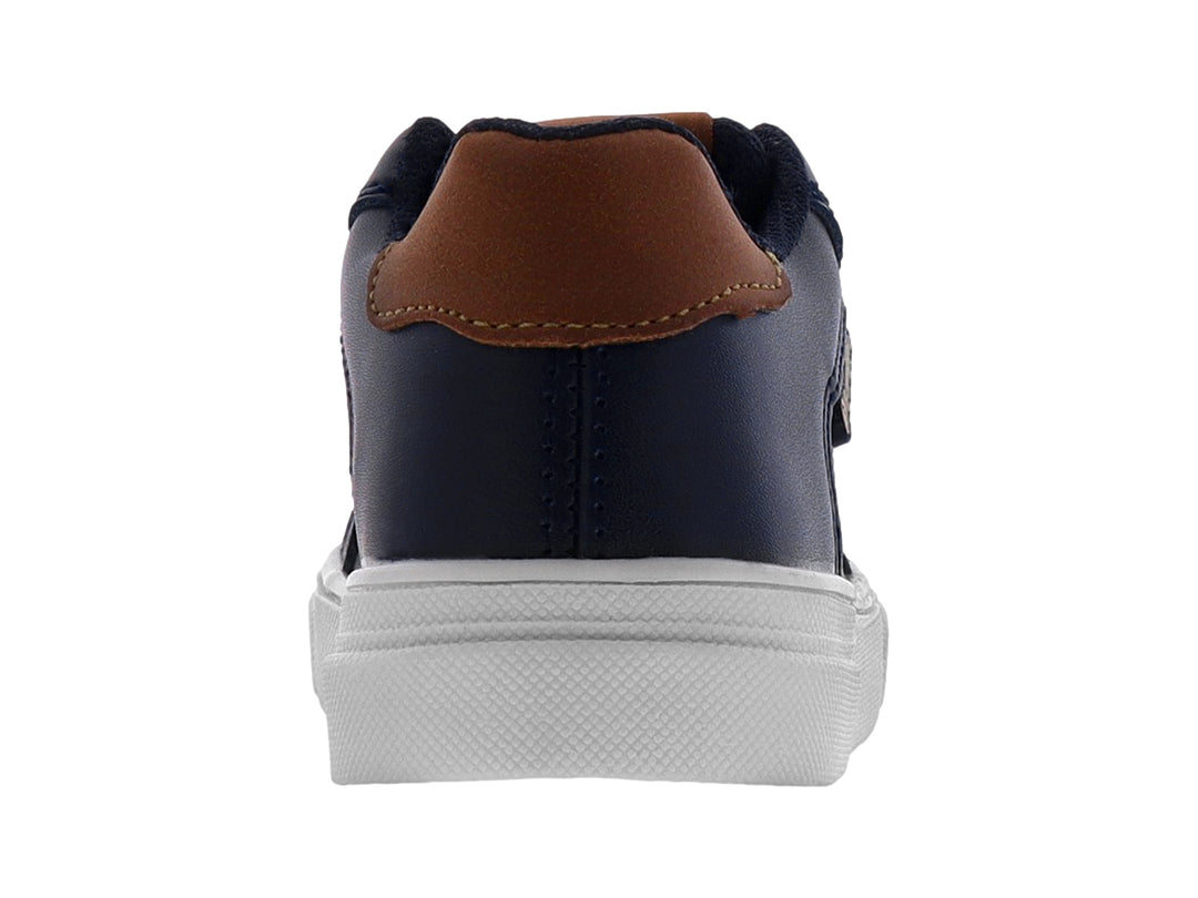 Tenis casuales para niño en color azul marino con detalles en camel y suela blanca.