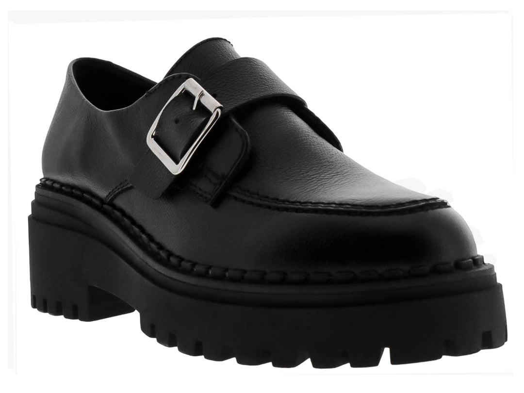 Mocasines negros para mujer con suela track gruesa y hebilla metálica plateada.