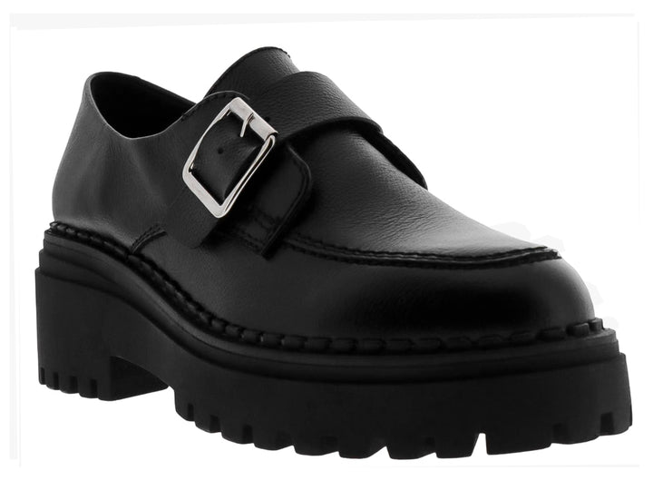 Mocasines negros para mujer con suela track gruesa y hebilla metálica plateada.