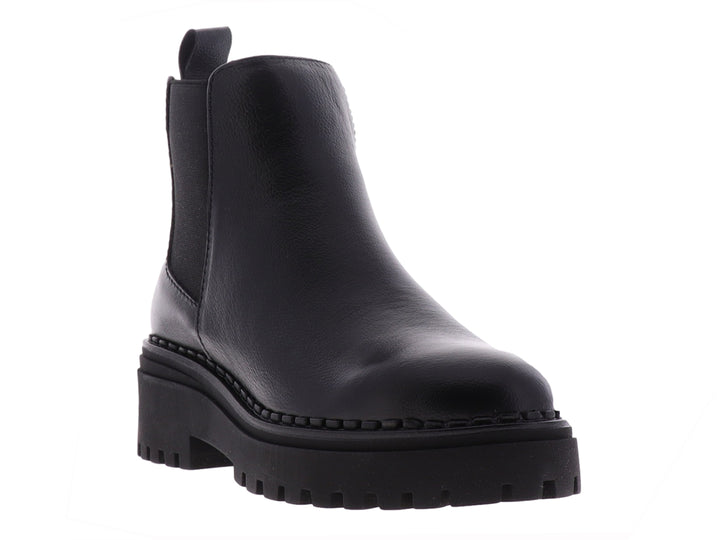 Botas Chelsea negras para niña con suela track gruesa y acabado liso.