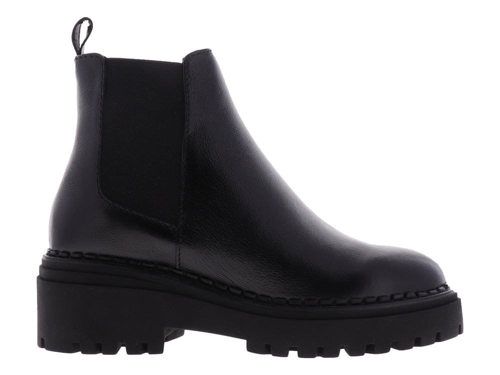 Botas Chelsea negras para niña con suela track gruesa y acabado liso.