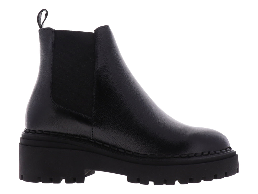 Botas Chelsea negras para niña con suela track gruesa y acabado liso.