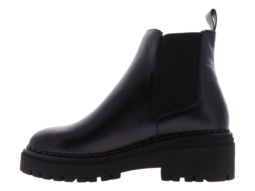 Botas Chelsea negras para niña con suela track gruesa y acabado liso.