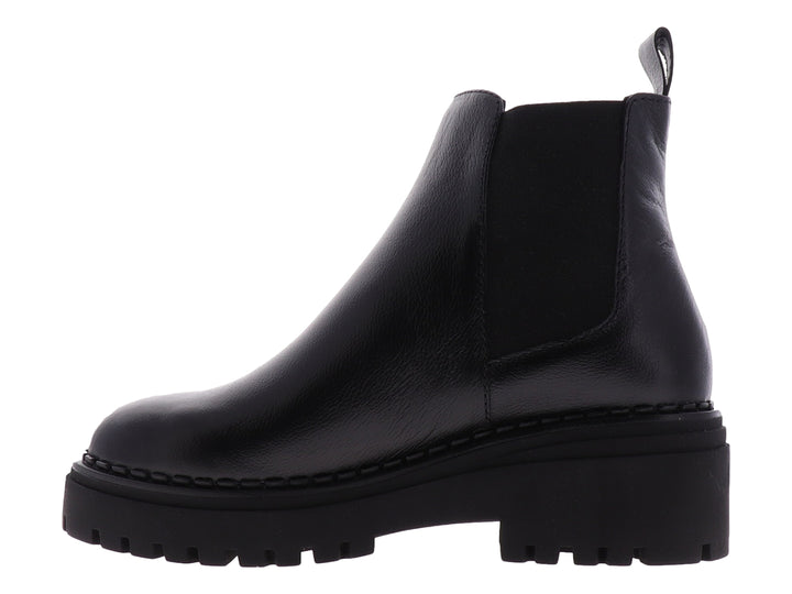 Botas Chelsea negras para niña con suela track gruesa y acabado liso.