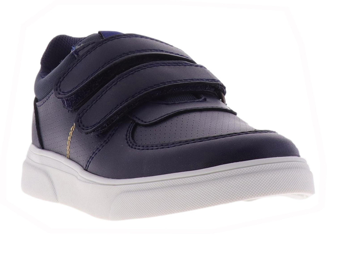 Tenis para niño color azul marino con suela blanca y cierre de velcro.