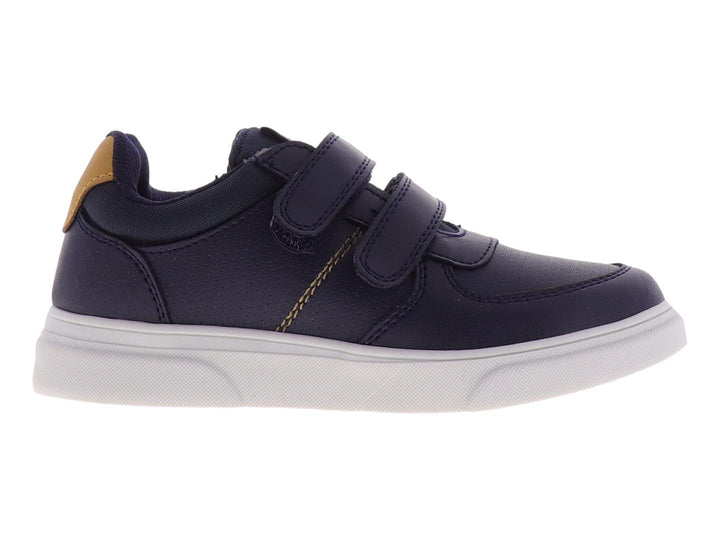 Tenis para niño color azul marino con suela blanca y cierre de velcro.