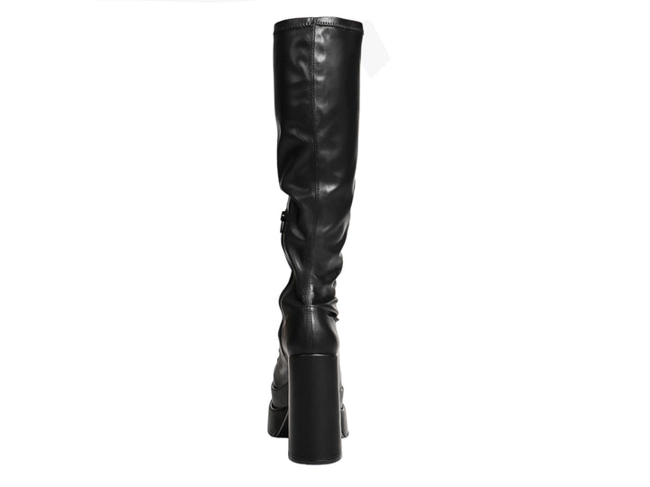 Botas altas negras con plataforma y tacón grueso sobre fondo blanco.
