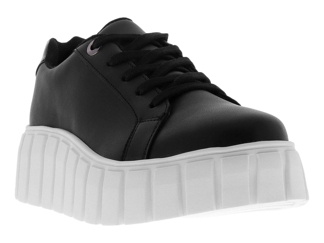 Tenis casuales para mujer en color negro con suela de plataforma blanca y gruesa.