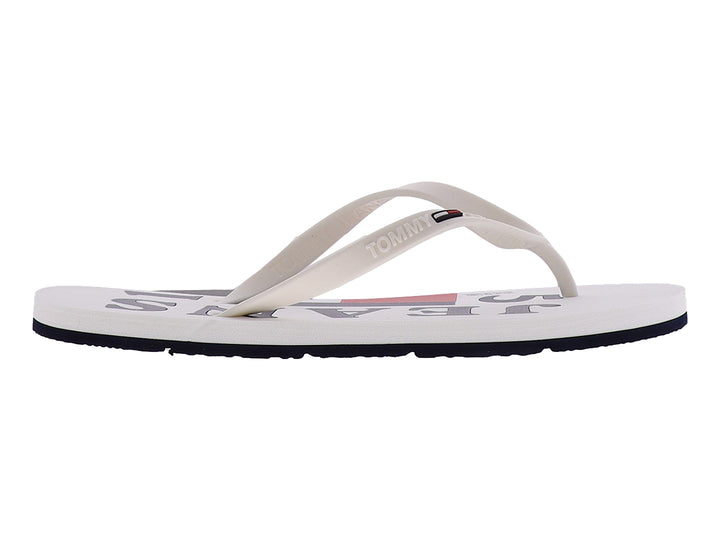 Sandalias Tommy Hilfiger blancas con suela azul marino y tiras sintéticas.