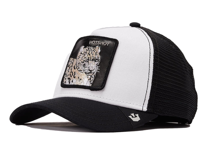 Gorra Goorin Bros blanca y negra con parche frontal de leopardo y malla trasera.
