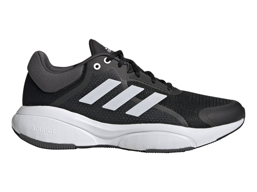 Tenis deportivos Adidas Response color negro con tres franjas blancas y suela blanca.