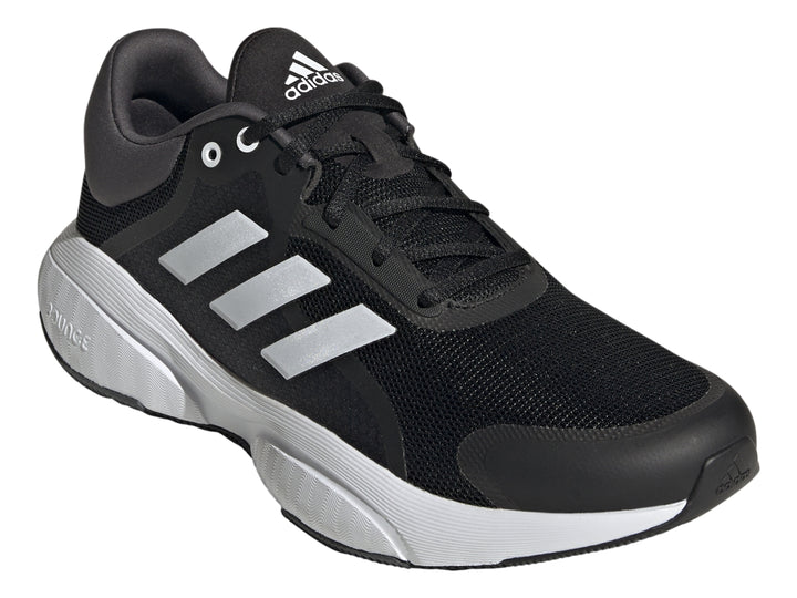 Tenis deportivos Adidas Response color negro con tres franjas blancas y suela blanca.
