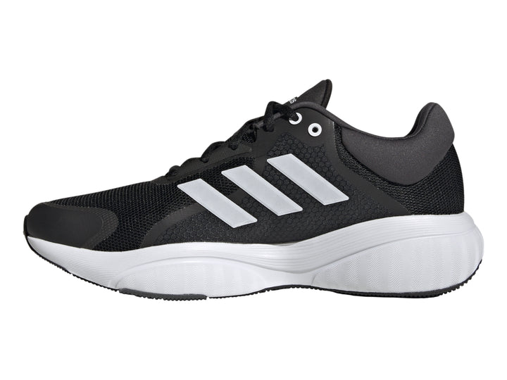 Tenis deportivos Adidas Response color negro con tres franjas blancas y suela blanca.