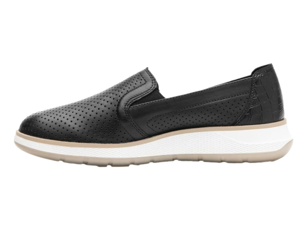 Zapato plano Flexi color negro de cuero perforado con suela blanca y beige para mujer.