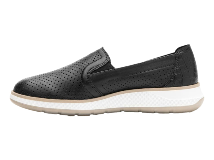 Zapato plano Flexi color negro de cuero perforado con suela blanca y beige para mujer.