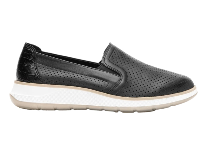 Zapato plano Flexi color negro de cuero perforado con suela blanca y beige para mujer.