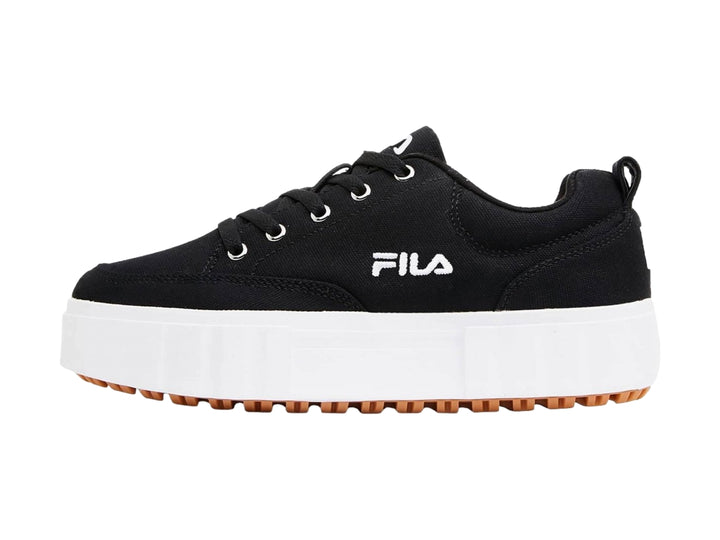Tenis FILA negros con suela de plataforma blanca y base color café.
