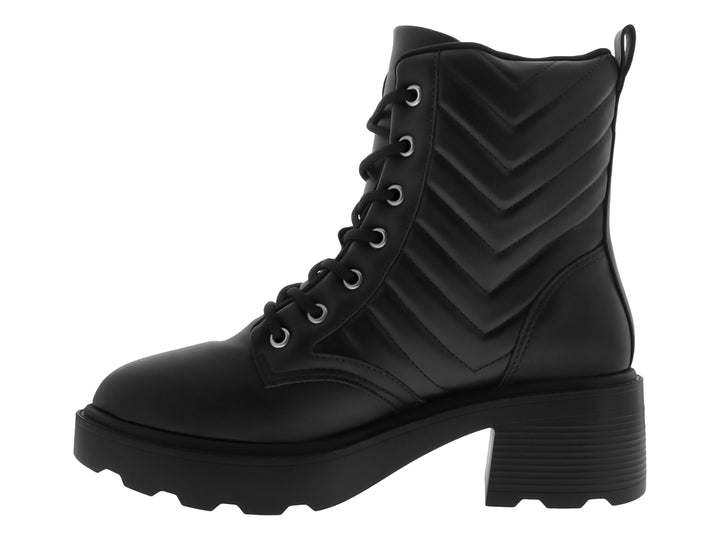 Botas negras de cuero Vizzano con suela track, tacón grueso y detalles acolchados laterales.