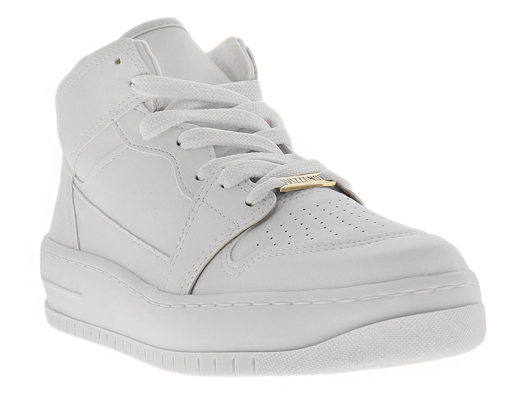 Tenis Vizzano color blanco con detalles dorados, diseño casual y suela plana sobre fondo blanco.