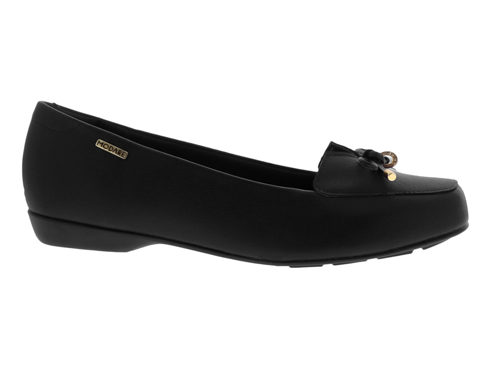 Zapato plano negro para mujer de la marca Modare con detalle de moño y puntas doradas.