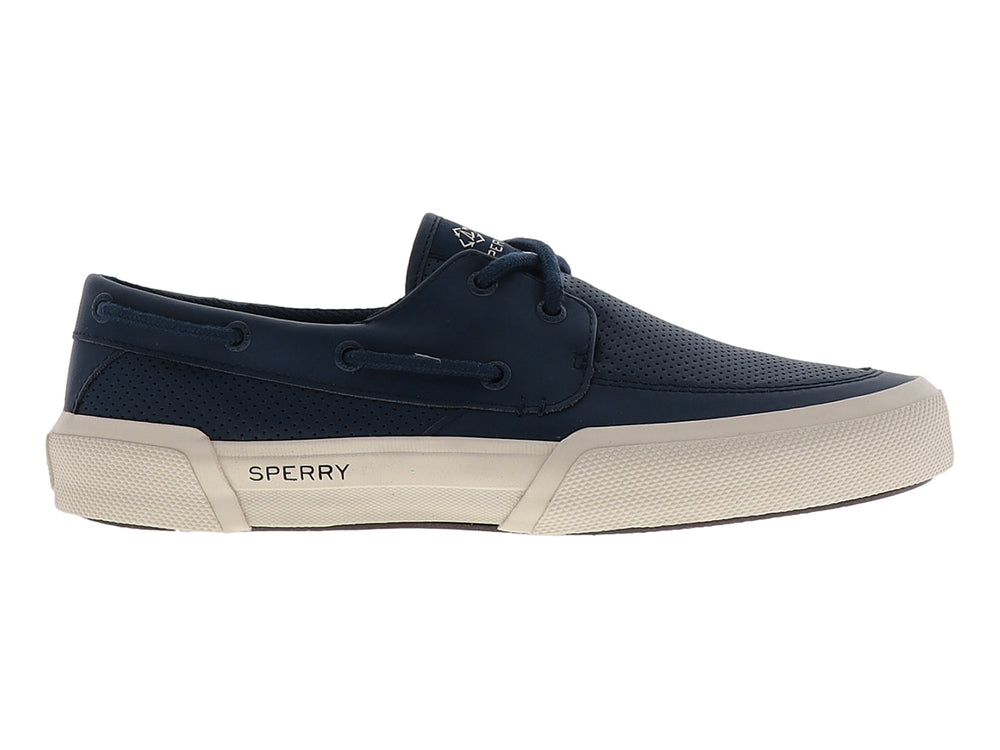 Zapato náutico Sperry azul marino con suela beige y superficie perforada.