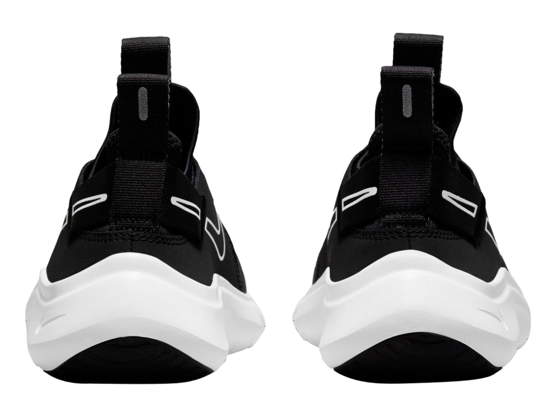 Tenis Nike Flex Plus color negro con suela blanca, estilo slip-on deportivo.