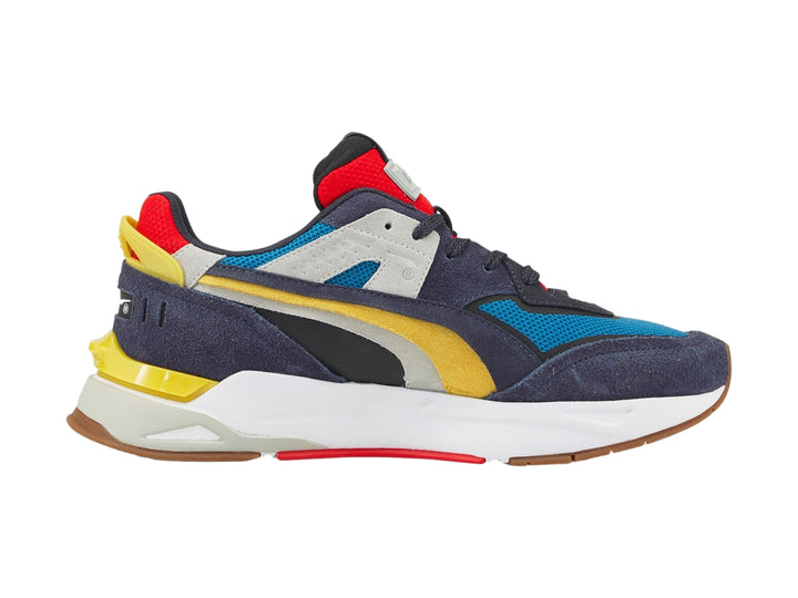 Tenis PUMA Mirage Sport Layers multicolor con detalles en azul, amarillo y rojo sobre suela blanca.