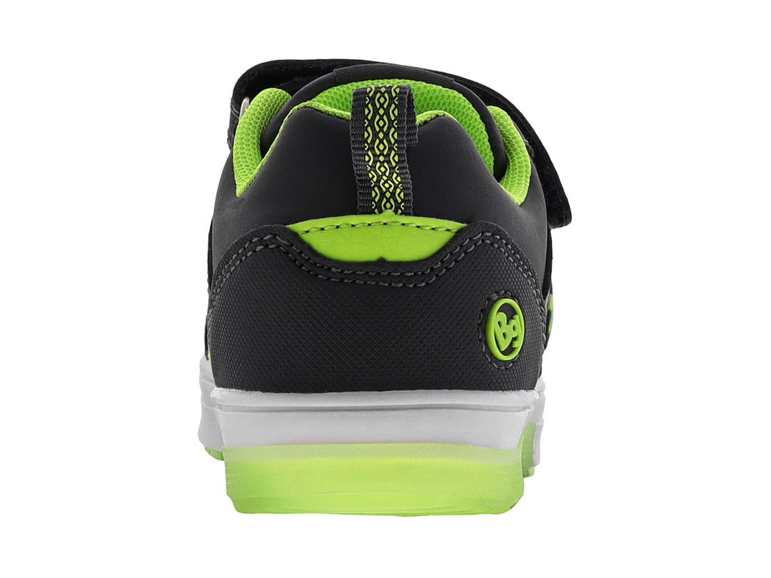 Tenis infantiles color gris con detalles en verde neón, cierre de velcro y diseño de cohete lateral.