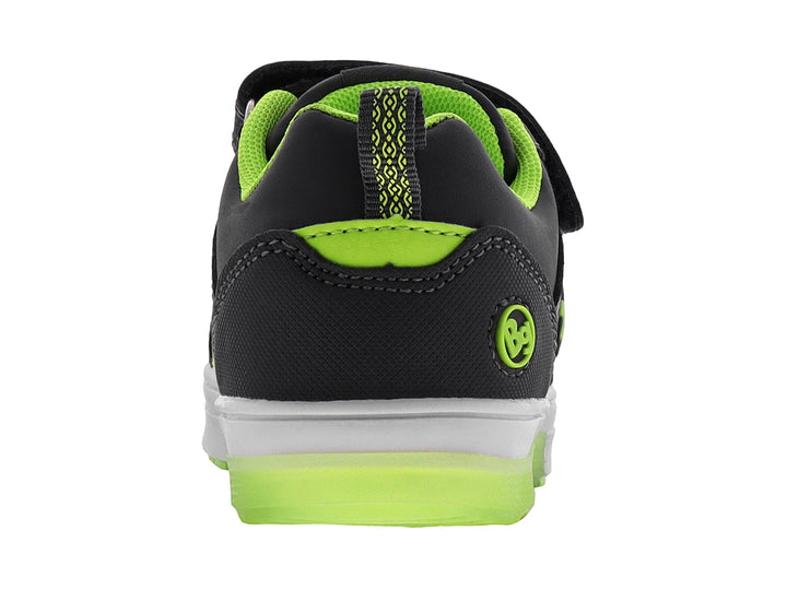 Tenis infantiles color gris con detalles en verde neón, cierre de velcro y diseño de cohete lateral.